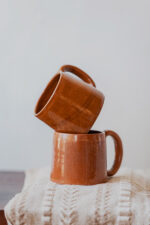 Glazed handmade ceramic mug in earthy tones