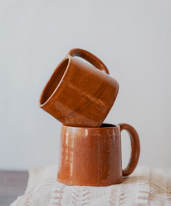 Glazed handmade ceramic mug in earthy tones