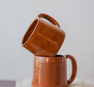 Glazed handmade ceramic mug in earthy tones