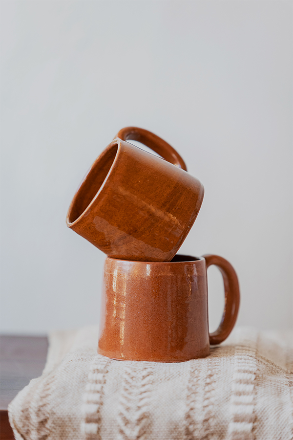 Glazed handmade ceramic mug in earthy tones
