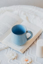 Glazed handmade ceramic mug in earthy tones
