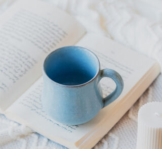 Glazed handmade ceramic mug in earthy tones