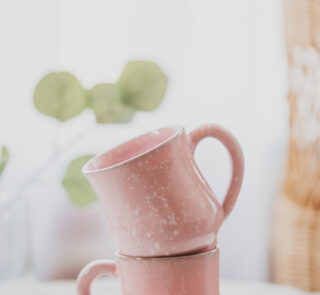Glazed handmade ceramic mug in earthy tones
