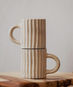 Glazed handmade ceramic mug in earthy tones