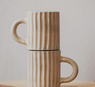 Glazed handmade ceramic mug in earthy tones