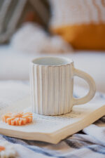 Glazed handmade ceramic mug in earthy tones