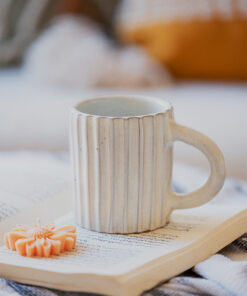 Glazed handmade ceramic mug in earthy tones