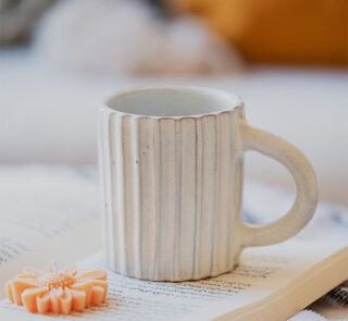 Glazed handmade ceramic mug in earthy tones