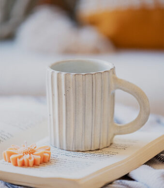 Glazed handmade ceramic mug in earthy tones