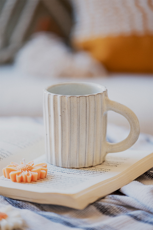 Glazed handmade ceramic mug in earthy tones