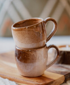 Glazed handmade ceramic mug in earthy tones