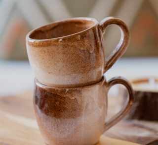 Glazed handmade ceramic mug in earthy tones