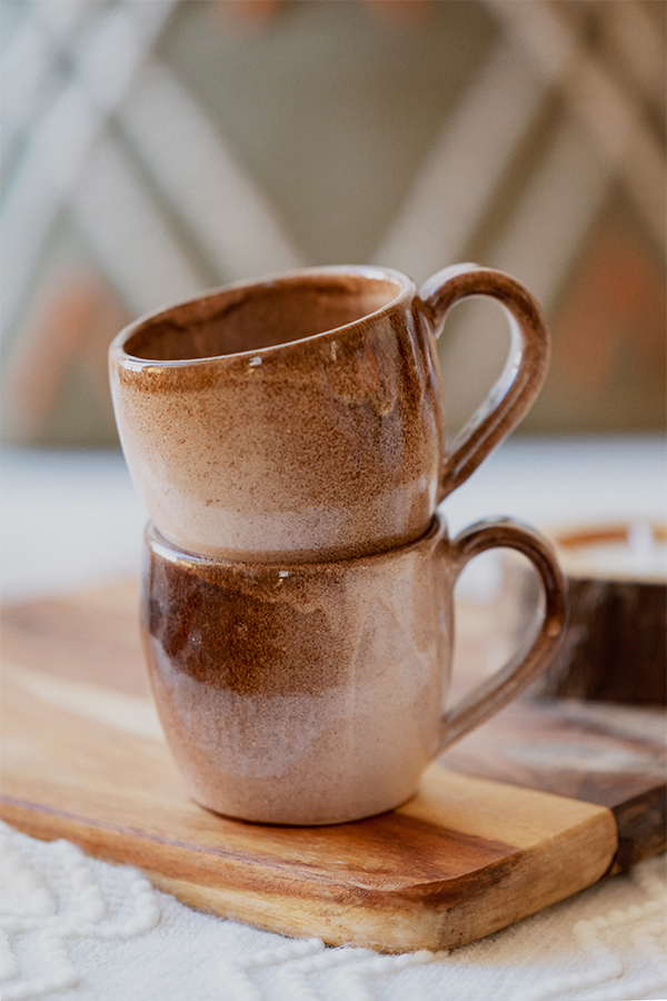 Glazed handmade ceramic mug in earthy tones