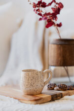 Glazed handmade ceramic mug in earthy tones