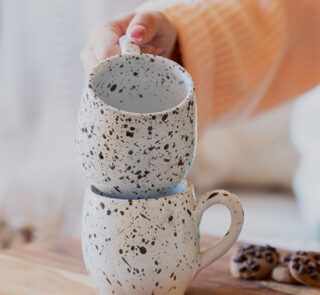 Glazed handmade ceramic mug in earthy tones