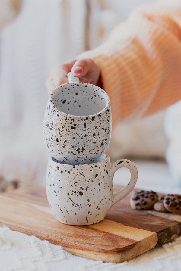 Glazed handmade ceramic mug in earthy tones