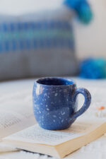 Glazed handmade ceramic mug in earthy tones