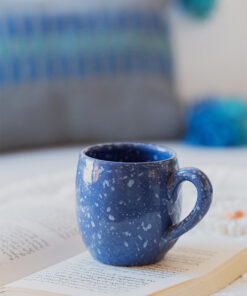 Glazed handmade ceramic mug in earthy tones