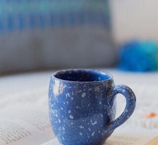 Glazed handmade ceramic mug in earthy tones