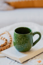 Glazed handmade ceramic mug in earthy tones