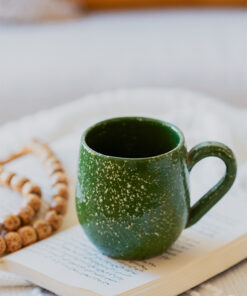 Glazed handmade ceramic mug in earthy tones