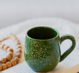 Glazed handmade ceramic mug in earthy tones