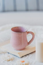 Glazed handmade ceramic mug in earthy tones