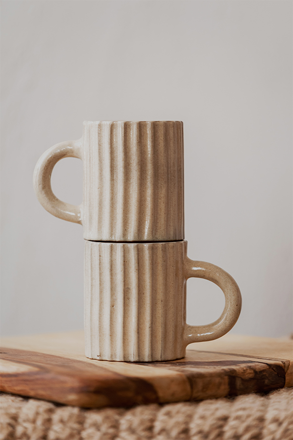 Glazed handmade ceramic mug in earthy tones