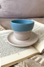 Aeris stoneware Cup Made for slow, easy moments A handcrafted stoneware cup and saucer in soft sky and sand tones, with delicate caramel speckles and a perfectly fitted base.