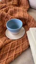 Aeris stoneware Cup Made for slow, easy moments A handcrafted stoneware cup and saucer in soft sky and sand tones, with delicate caramel speckles and a perfectly fitted base.
