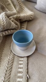 Aeris stoneware Cup Made for slow, easy moments A handcrafted stoneware cup and saucer in soft sky and sand tones, with delicate caramel speckles and a perfectly fitted base.