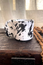 Glazed handmade ceramic mug in earthy tones