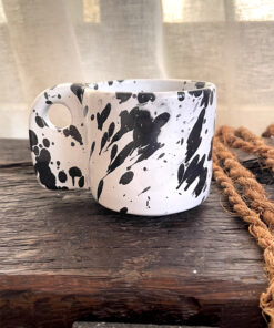 Glazed handmade ceramic mug in earthy tones