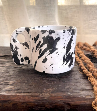 Glazed handmade ceramic mug in earthy tones