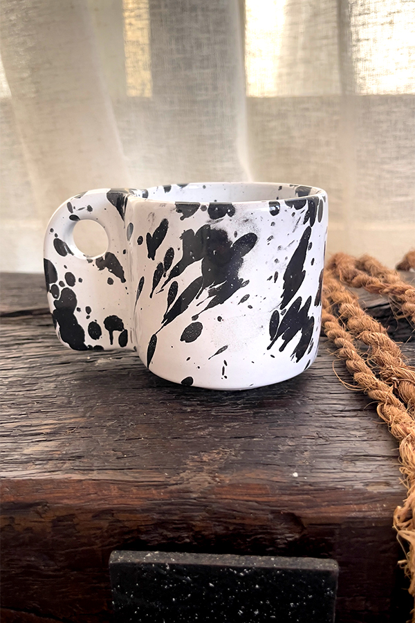 Glazed handmade ceramic mug in earthy tones