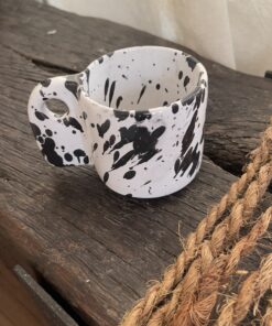 Glazed handmade ceramic mug in earthy tones