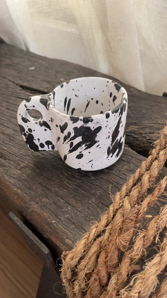 Glazed handmade ceramic mug in earthy tones