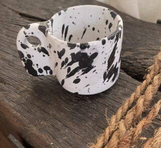 Glazed handmade ceramic mug in earthy tones