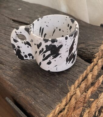Glazed handmade ceramic mug in earthy tones