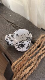 Glazed handmade ceramic mug in earthy tones