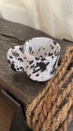 Glazed handmade ceramic mug in earthy tones