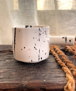 Herba Stoneware Mug Familiar, but reimagined A creamy beige stoneware mug with black speckles, inspired by traditional coffee pots and daily rituals.