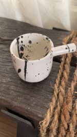Herba Stoneware Mug Familiar, but reimagined A creamy beige stoneware mug with black speckles, inspired by traditional coffee pots and daily rituals.