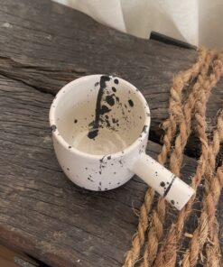 Herba Stoneware Mug Familiar, but reimagined A creamy beige stoneware mug with black speckles, inspired by traditional coffee pots and daily rituals.
