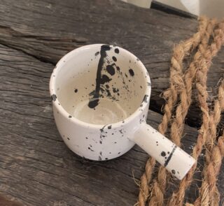 Herba Stoneware Mug Familiar, but reimagined A creamy beige stoneware mug with black speckles, inspired by traditional coffee pots and daily rituals.