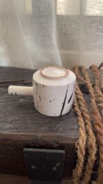 Herba Stoneware Mug Familiar, but reimagined A creamy beige stoneware mug with black speckles, inspired by traditional coffee pots and daily rituals.
