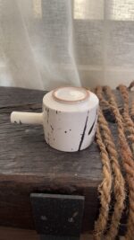Herba Stoneware Mug Familiar, but reimagined A creamy beige stoneware mug with black speckles, inspired by traditional coffee pots and daily rituals.