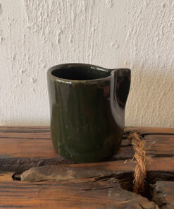 Oliva Stoneware Mug Lighter than it looks. richer than it feels A glossy olive-toned stoneware mug with subtle yellow-green speckles and a flat handle, carrying a fresh, natural energy in every sip.