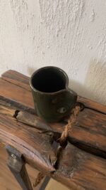 Oliva Stoneware Mug Lighter than it looks. richer than it feels A glossy olive-toned stoneware mug with subtle yellow-green speckles and a flat handle, carrying a fresh, natural energy in every sip.