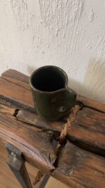 Oliva Stoneware Mug Lighter than it looks. richer than it feels A glossy olive-toned stoneware mug with subtle yellow-green speckles and a flat handle, carrying a fresh, natural energy in every sip.